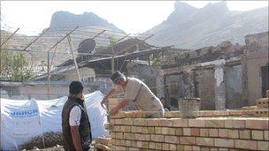 Uzbeks rebuilding houses