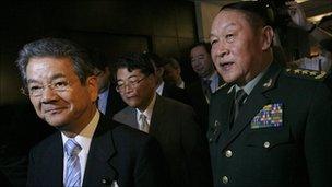 Japan's Defence Minister Toshimi Kitazawa (L) and China's Defence Minister Liang Guanglie (R)