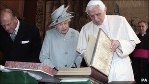 Pope Benedict XVI shows the Queen the copy of the Lorsch Gospels