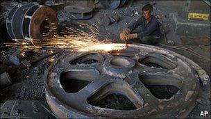 An Indian labourer works in a factory in Dholka