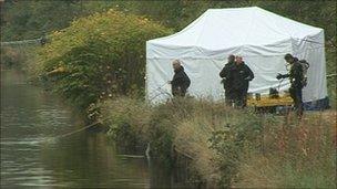Police next to the Sheffield and South Yorkshire Navigation Canal