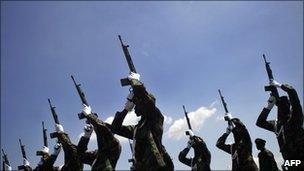 Sudan's Joint Integrated Unit soldiers firing a gun salute (May 2008)