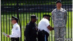 Lt Dan Choi, shown chained to the White House fence