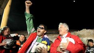 Chilean miner Luis Urzua celebrates with Chile's president Sebastian Pinera