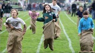 Children take part in the sack race during the Braemar Highland Games