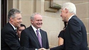 Peter Robinson and Martin McGuinness greet Bill Clinton