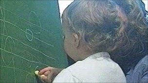 Toddler at blackboard
