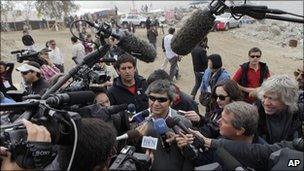 Miner Juan Carlos Aguilar returns to the San Jose amid a media scrum (17 Oct 2010)