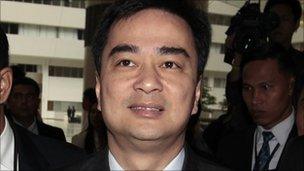 Thai Prime Minister Abhisit Vejjajiva arrives at the Constitution Court in Bangkok