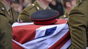 Cpl Thomas' cap on his coffin