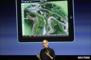 Apple chief executive Steve Jobs presenting in front of a blow-up image of an iPad