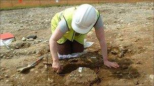An archaeologist excavating a Bronze Age crematorium