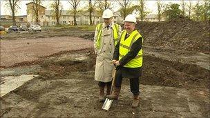 Housing minister Alex Neil cuts the first sod of earth from the Gracemount site