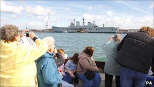 Sightseers taking pictures of HMS Ark Royal