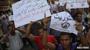 Egyptian protesters shout slogans during an anti-government protest in Cairo, September 2010