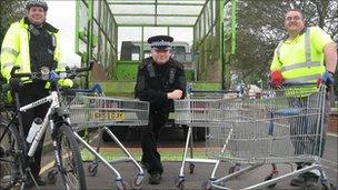 Police and council officers after the trolley clear-up