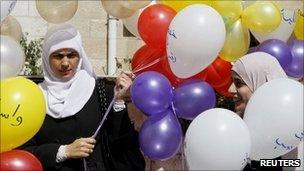 Islamic Action Front activists with balloons in front of their headquarters in Amman, 16 October