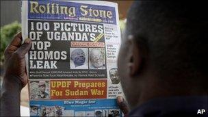 Man holding copy of the Rolling Stone