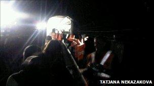 Passenger Tatjana Nekazakova's photo shows commuters being walked out of a tunnel near Seven Sisters station