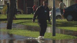 Residents walk through the flooded streets in Wolverhampton