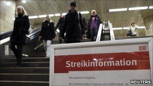 A message board warns of disruption due to strike action at a Berlin railway station, 26 October