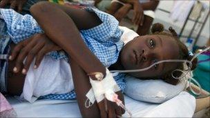 A girl receives treatment for cholera in St Marc, Haiti (26 Oct 2010)