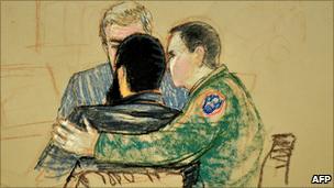 In an illustration from a courtroom at Guantanamo Bay, Cuba, Omar Khadr is comforted by his legal team