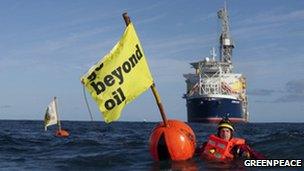 An environmentalist halts the progress of the Stena Carron drilling ship
