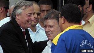 Nestor Kirchner with Colombia's president Juan Manuel Santos (middle) and Venezuelan leader Hugo Chavez (right) in Santa Marta, Colombia, August 2010