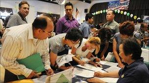 Unemployed Americans attend a job fair in California