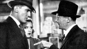 Photograph of actors John Longden, Anny Ondra and Donald Calthrop in Blackmail.