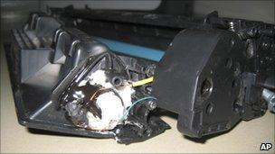 Parts of a computer printer with explosives loaded into its toner cartridge