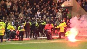 Flare thrown on pitch at Plymouth v Exeter match
