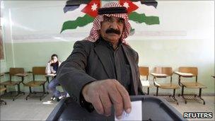 A man casts his ballot in Amman