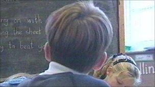 Boy looking at blackboard