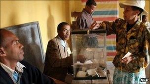 A resident of the Madagascar's capital, Antananarivo, casts her vote on 17 November