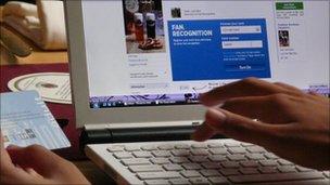 A woman registers as a fan on Facebook