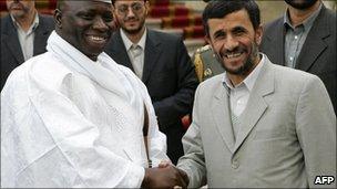 Iranian President Mahmud Ahmadinejad (right) shakes hands with the President of Gambia Yahya Jammeh in Tehran, 2 December 2006