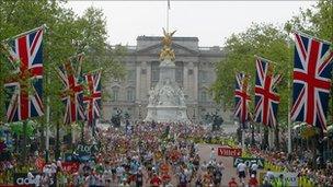 London Marathon participants run down The Mall