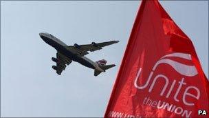 A BA plane takes off over a Unite picket line near Heathrow Airport during a previous strike in May this year