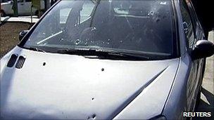 Bullet marks one of the scientist's cars (image from AlAlam TV)