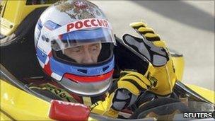 Russian Prime Minister Vladimir Putin at the wheel of a car from the Renault Formula One team near St Petersburg, 7 November