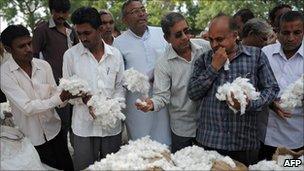 Buyers holding cotton at an auction
