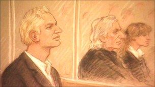Julian Assange (left) in court