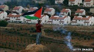 Palestinian protester opposite Jewish settlement of Halamish in the West Bank. Oct 2010