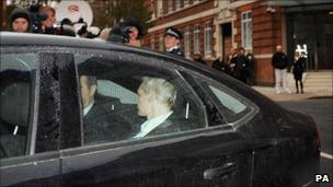 Julian Assange in a car