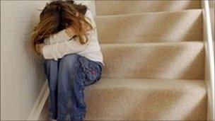 Scared child on stairs