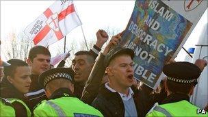 Members of the English Defence League demonstrate during a march through the centre of Peterborough, Cambridgeshire, on Saturday 11 December