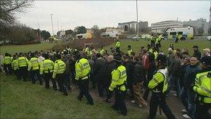 Police escort football fans