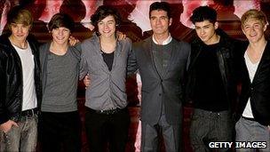 Simon Cowell (centre) with One Direction